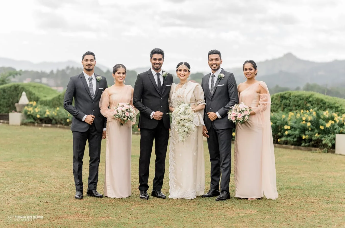 Wedding party wearing elegant formal suits and dresses